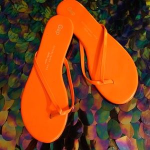 Orange leather flip flops